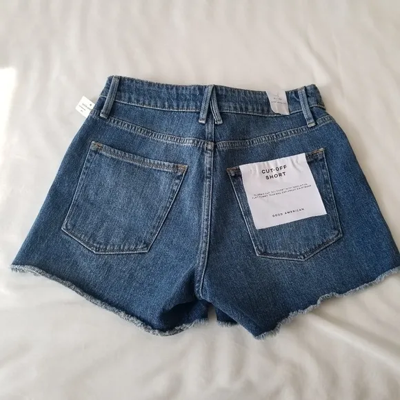 Good American The cut off fold over waist denim shorts