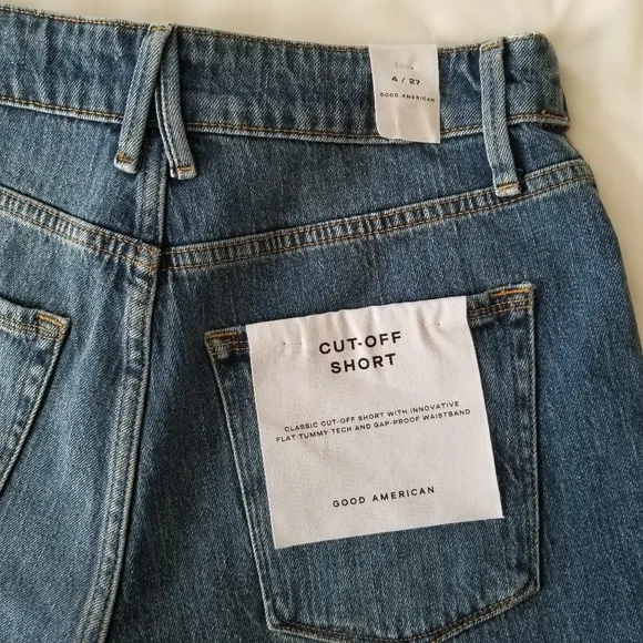 Good American The cut off fold over waist denim shorts