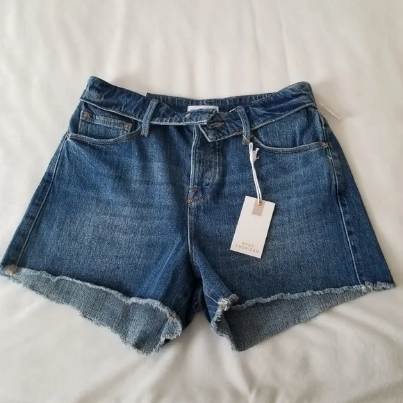 Good American The cut off fold over waist denim shorts