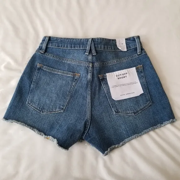 Good American The cut off fold over waist denim shorts