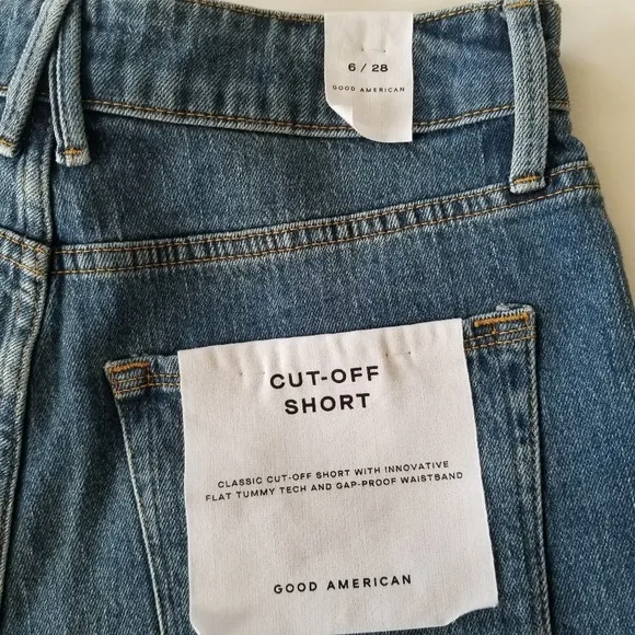 Good American The cut off fold over waist denim shorts