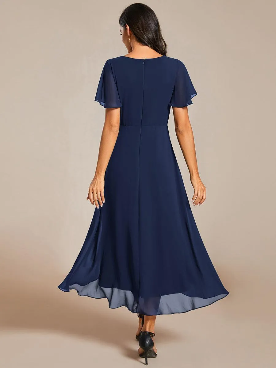 Robe de soirée midi en mousseline plissée à col en V et manches volantées