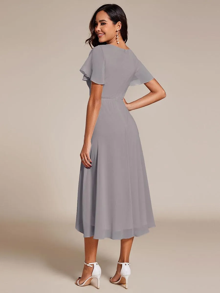 Robe de soirée midi en mousseline plissée à col en V et manches volantées