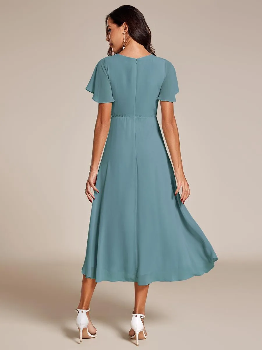 Robe de soirée midi en mousseline plissée à col en V et manches volantées