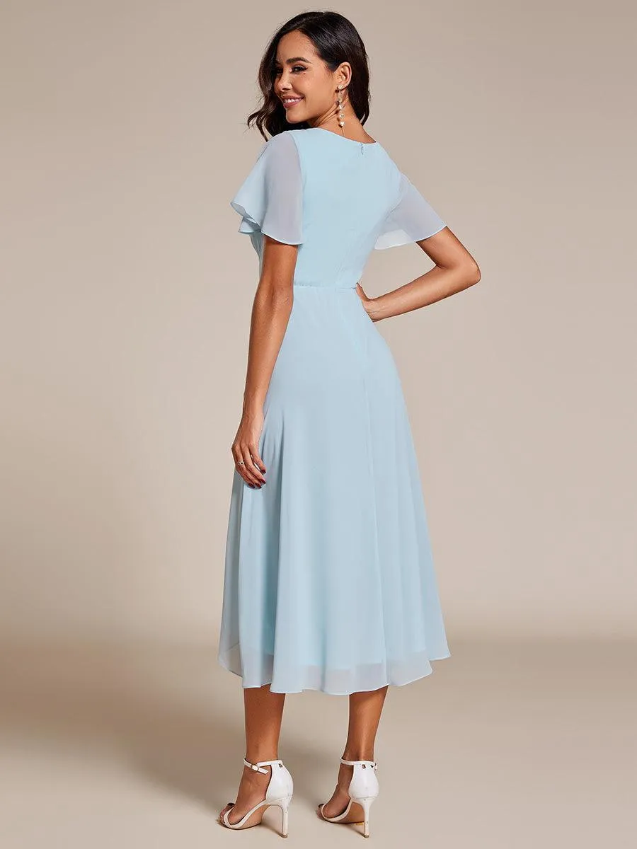 Robe de soirée midi en mousseline plissée à col en V et manches volantées